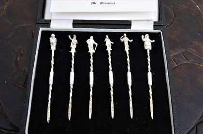 Cased set of six silver cherry sticks