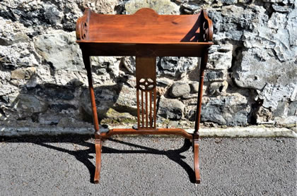 Edwardian mahogany bookstand/ trough
