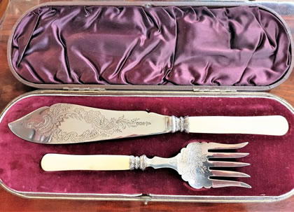 Silver fish servers, cased