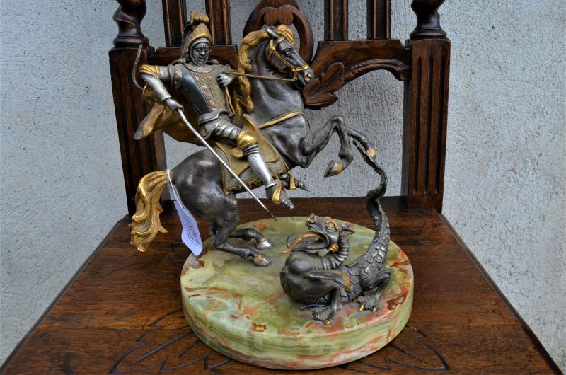 Metal figures on marble base