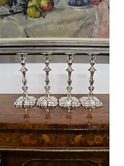 Set of four silver candlesticks