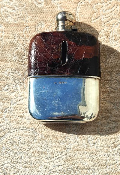 Silver and leather hip flask
