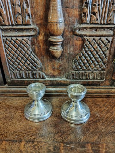 Pair of silver miniature candlesticks