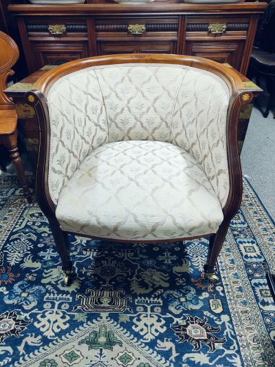 Edwardian mahogany covered armchair