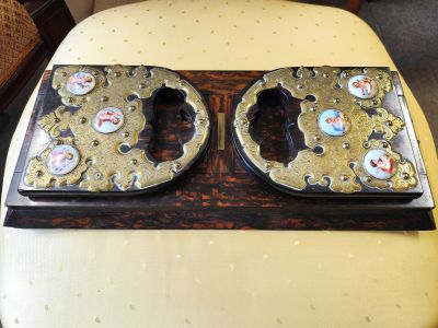 Coromandel & brass book slide with porcelain cherubs  by howell james & Co , regent street london