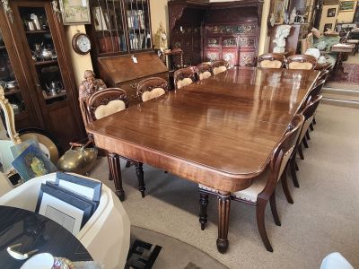 19th century mahogany three leaf dining table & twelve chairs