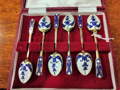 Cased set of silver & enamel spoons