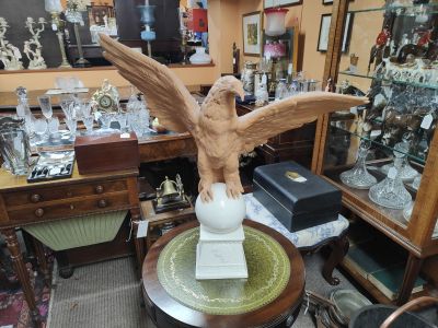 Terracotta eagle on porcelain base