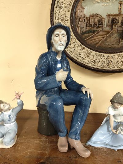 Large nao porcelain figure of a fisherman