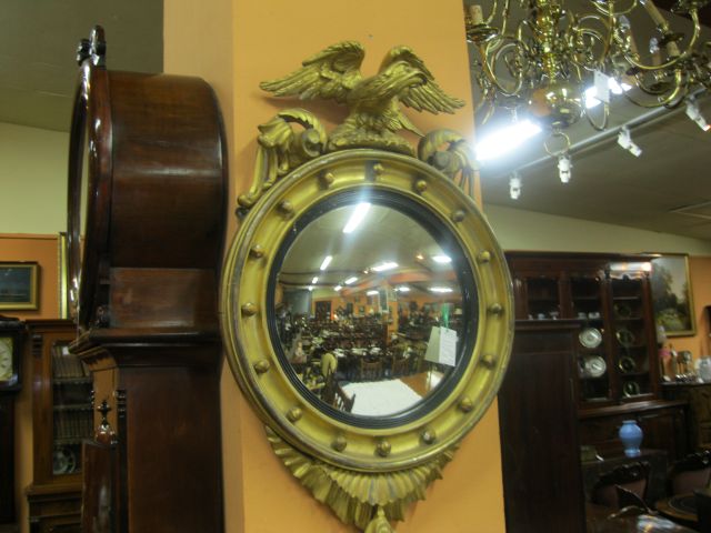 A regency giltwood convex mirror.