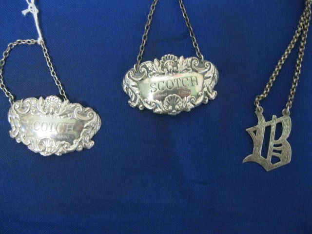 A selection of silver decanter labels
