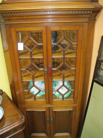 A 19th century mahogany corner cabinet