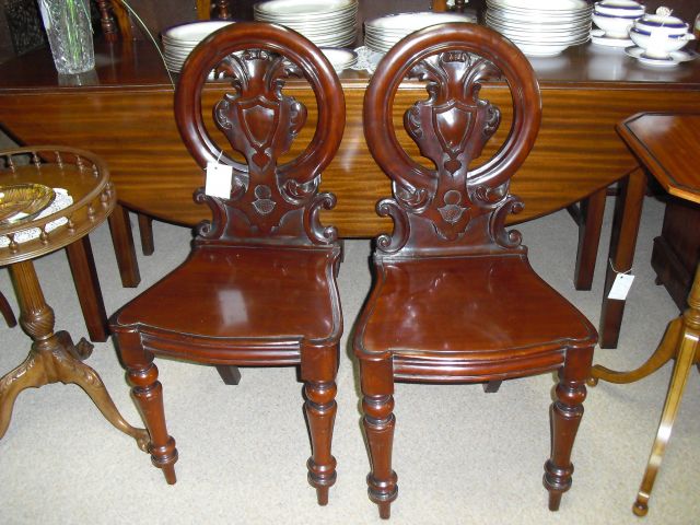 A pair of  Victorian mahogany hall chairs.