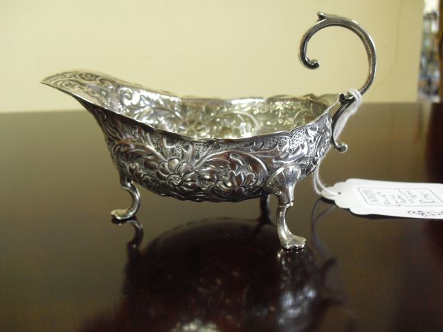A silver sauce boat.