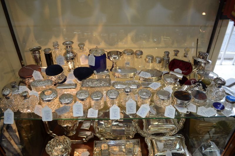 Large selection of antique perfume bottles etc in store