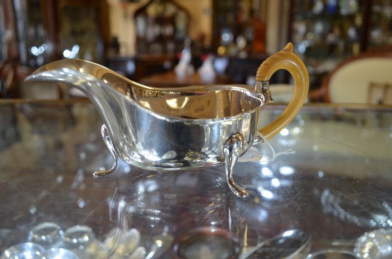Silver sauce boat with ivory handle