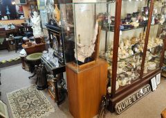 saxaphone plaster sculpture in glass display case Thumbnail 2