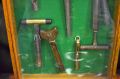 Oak glass cased collection of antique chesse scoops Thumbnail 2